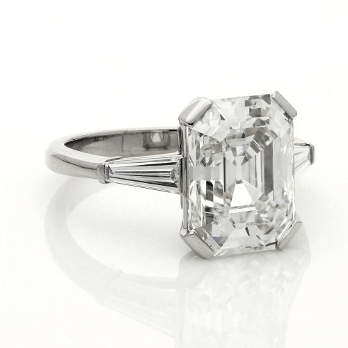 A 5.19ct old emerald-cut diamond ring set in platinum, tapered baguette shoulders £150,000